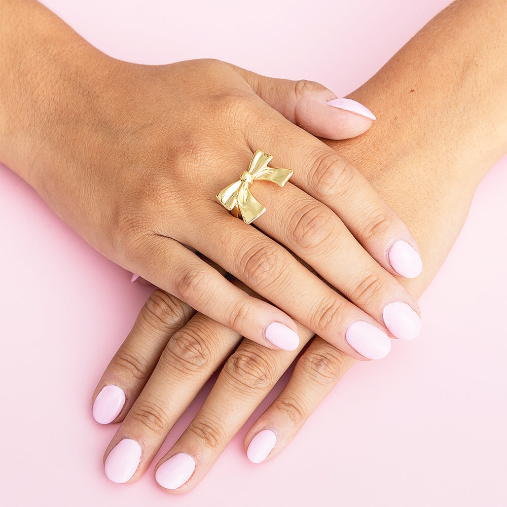 Adjustable Bow Ring on girls finger with pink