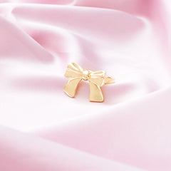 Adjustable Bow Ring on pink satin