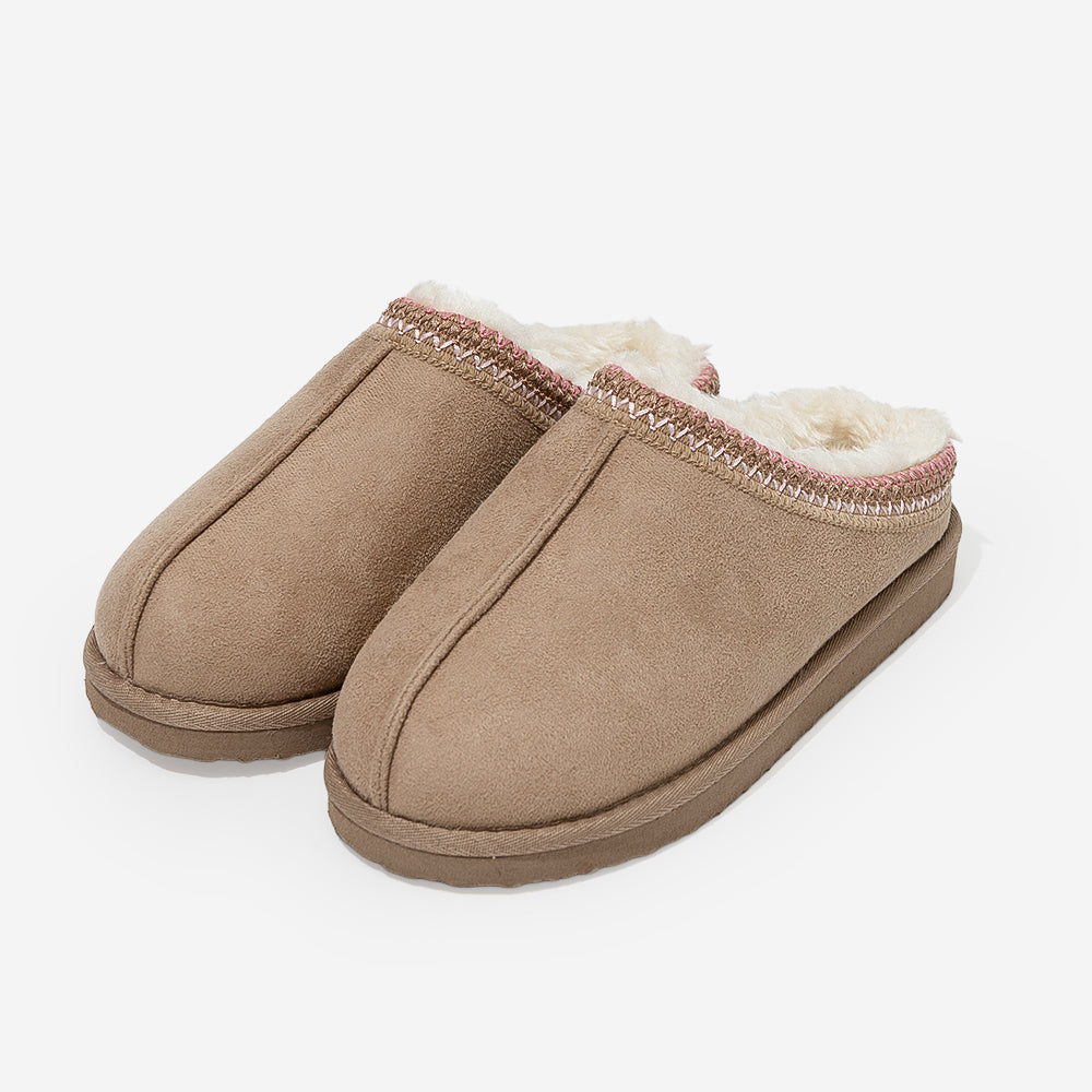 girl wearing moccasins in tanpink