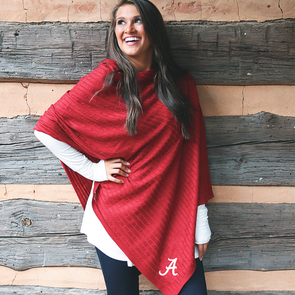 girl wearing crimson alabama poncho with white top