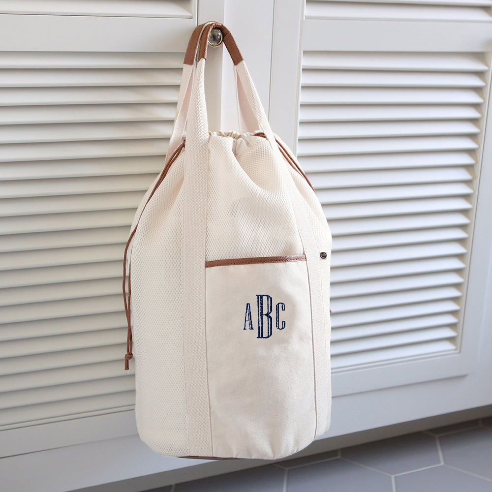 Ivory Packable Laundry Bag hanging around navy thread