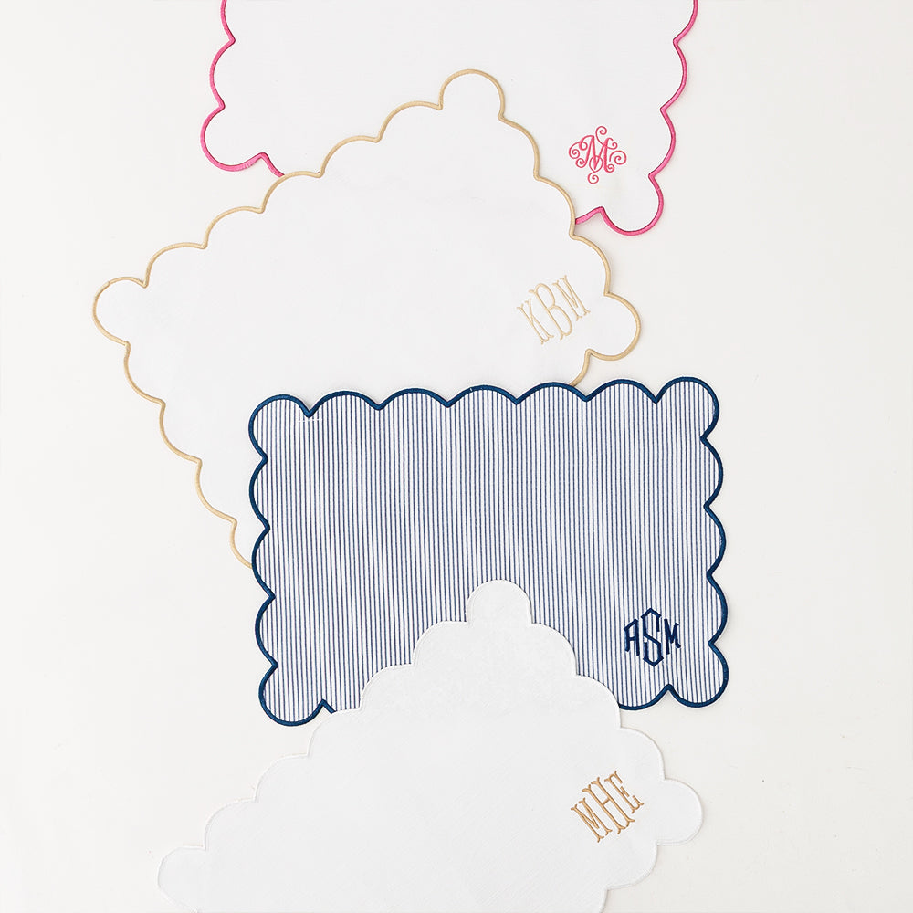 group of 4 scalloped placemats