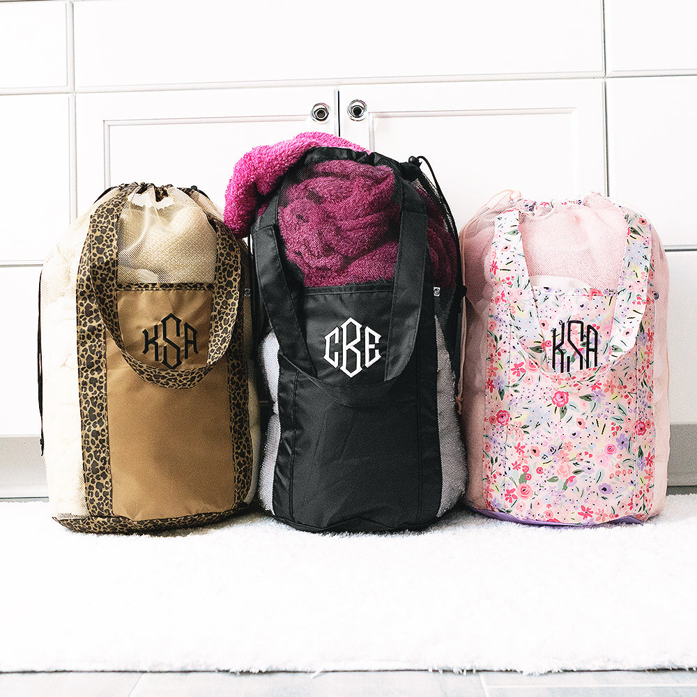 leopard, black and coral floral packable laundry bag in laundry room