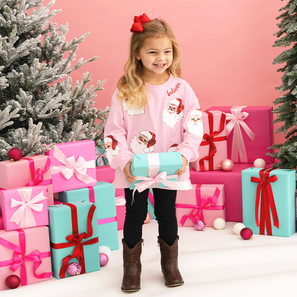 light pink christmas sweatshirt on sutton