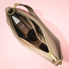 inside of tan shoulder bag