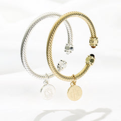 duo cable bracelets in gold and silver