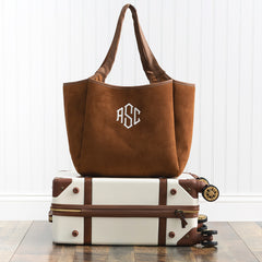 Brown suede timeless tote on vintage suitcase