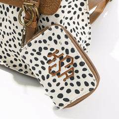 close up of white leopard keychain wallet