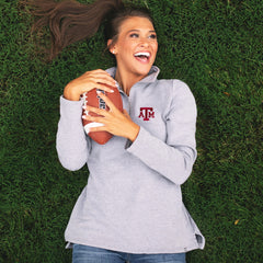 gray texas a&m pullover sweatshirt in grass with football