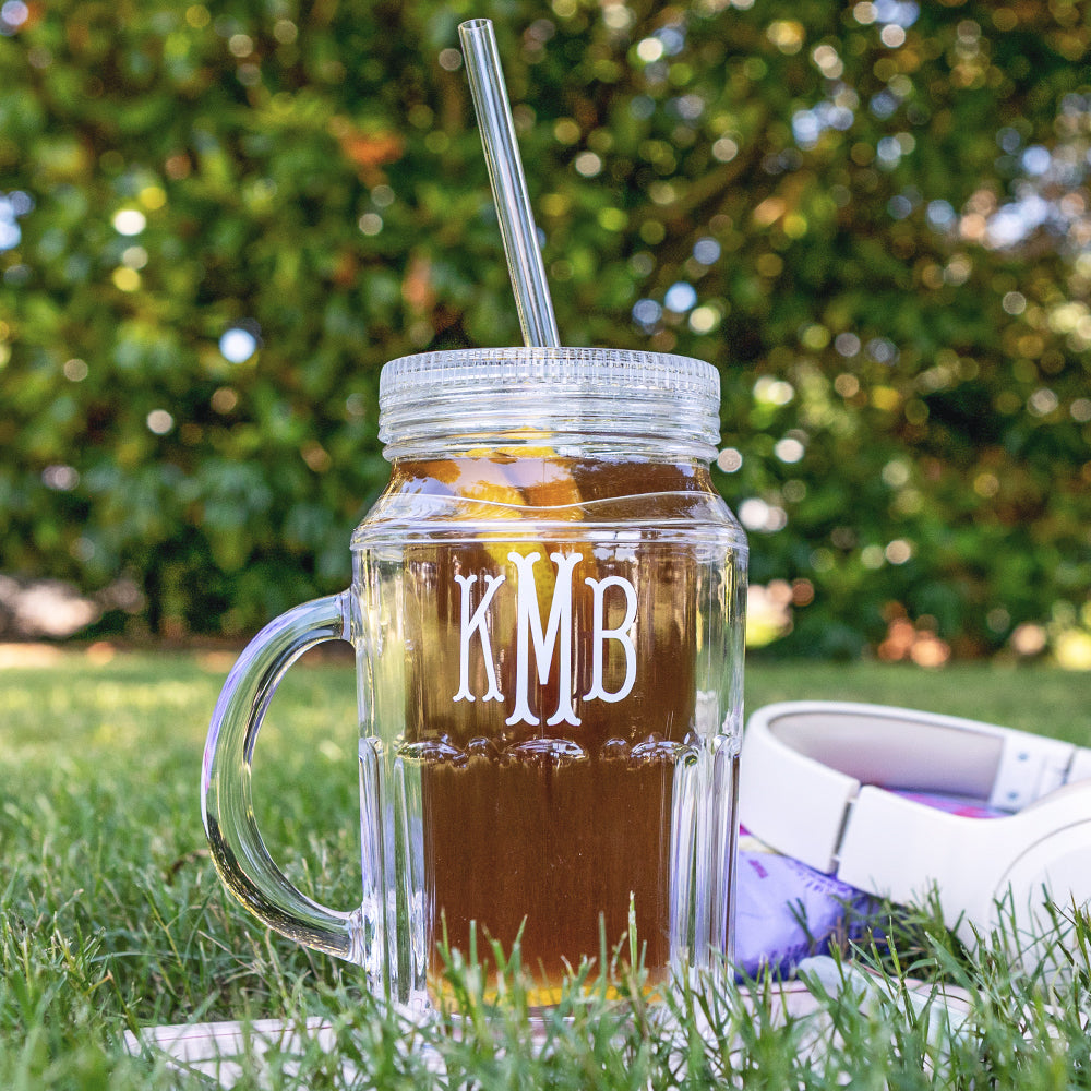 close up of personalized mason jar in grass