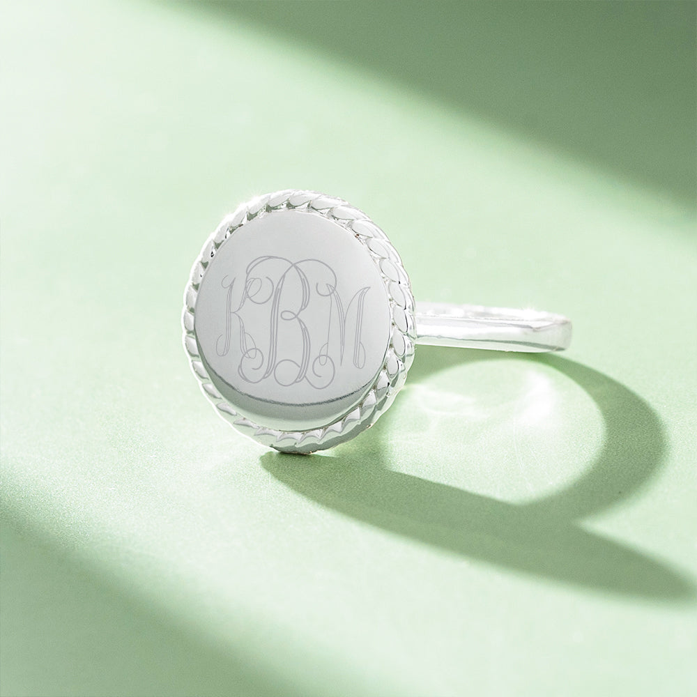 silver nala ring on green background