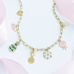 Christmas Charm Necklace flatlay with ribbon