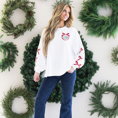 Christmas bow sweatshirt on rachel