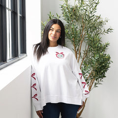 Christmas bow sweatshirt on julia ann