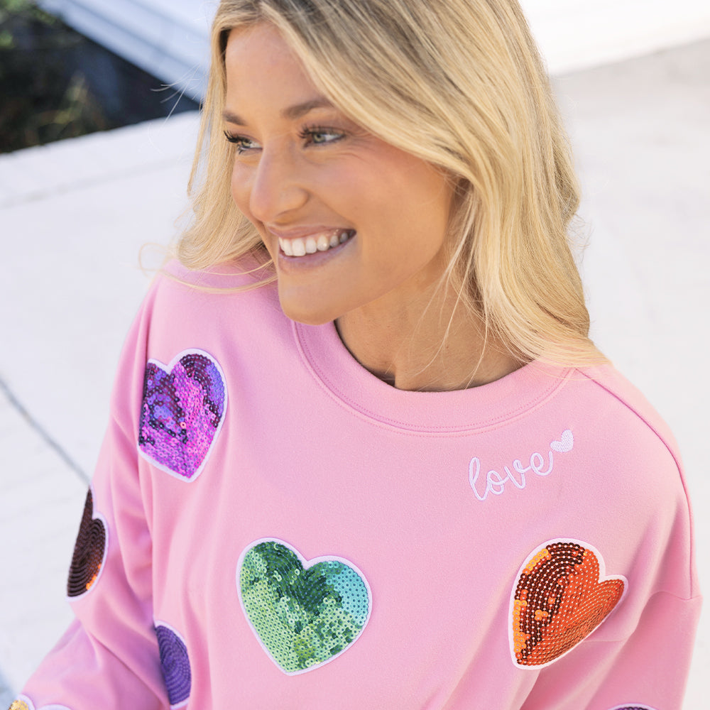 [ashley] close up of girl wearing sequin hearts sweatshirt