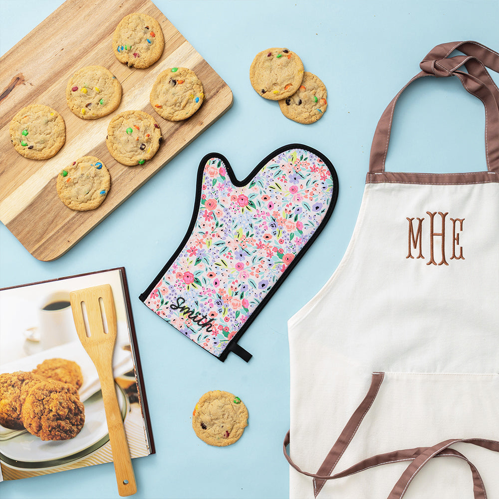 coral floral neoprene oven mitt flatlay