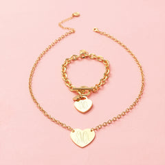 gold heart pendant necklace with heart bracelet