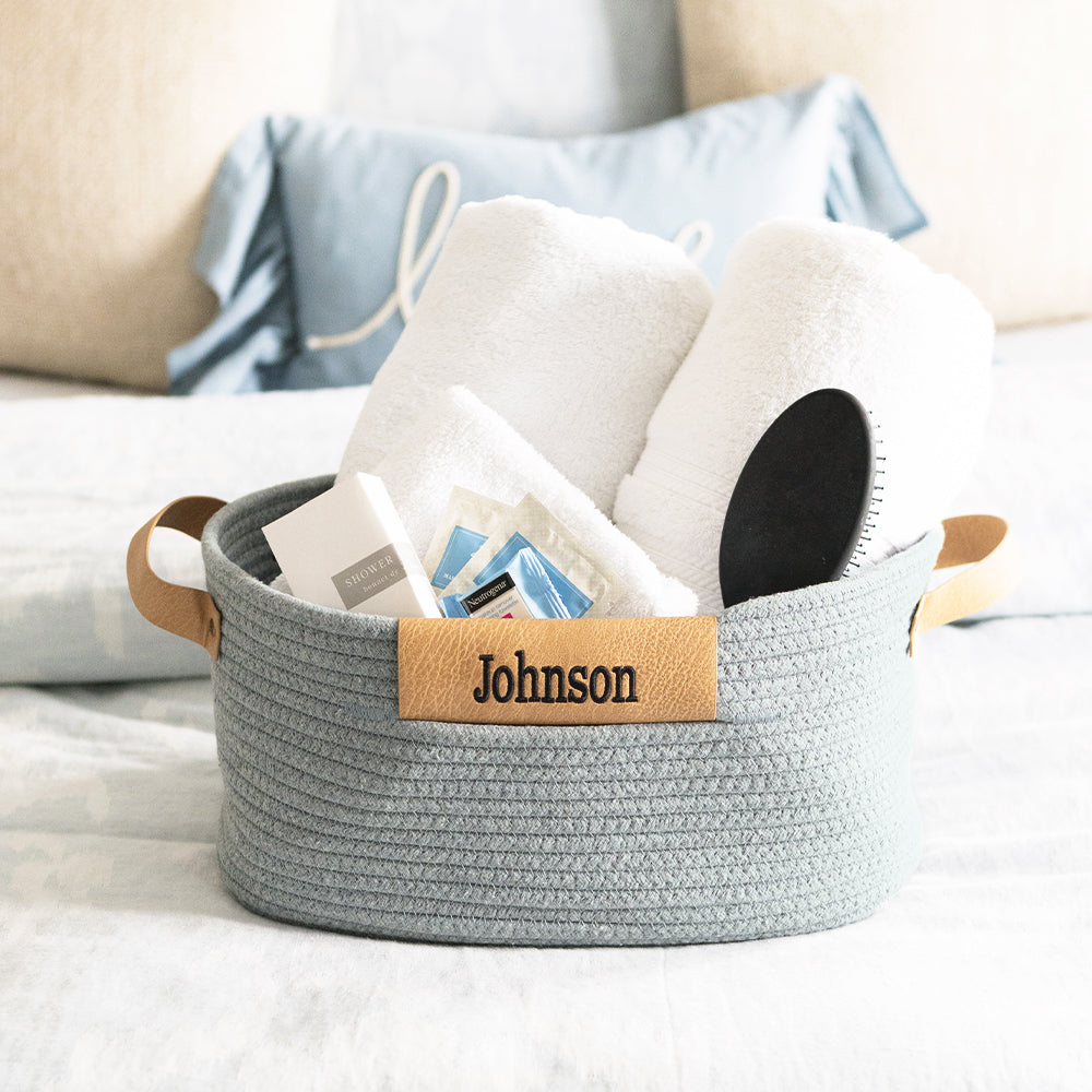 gray basket on bed