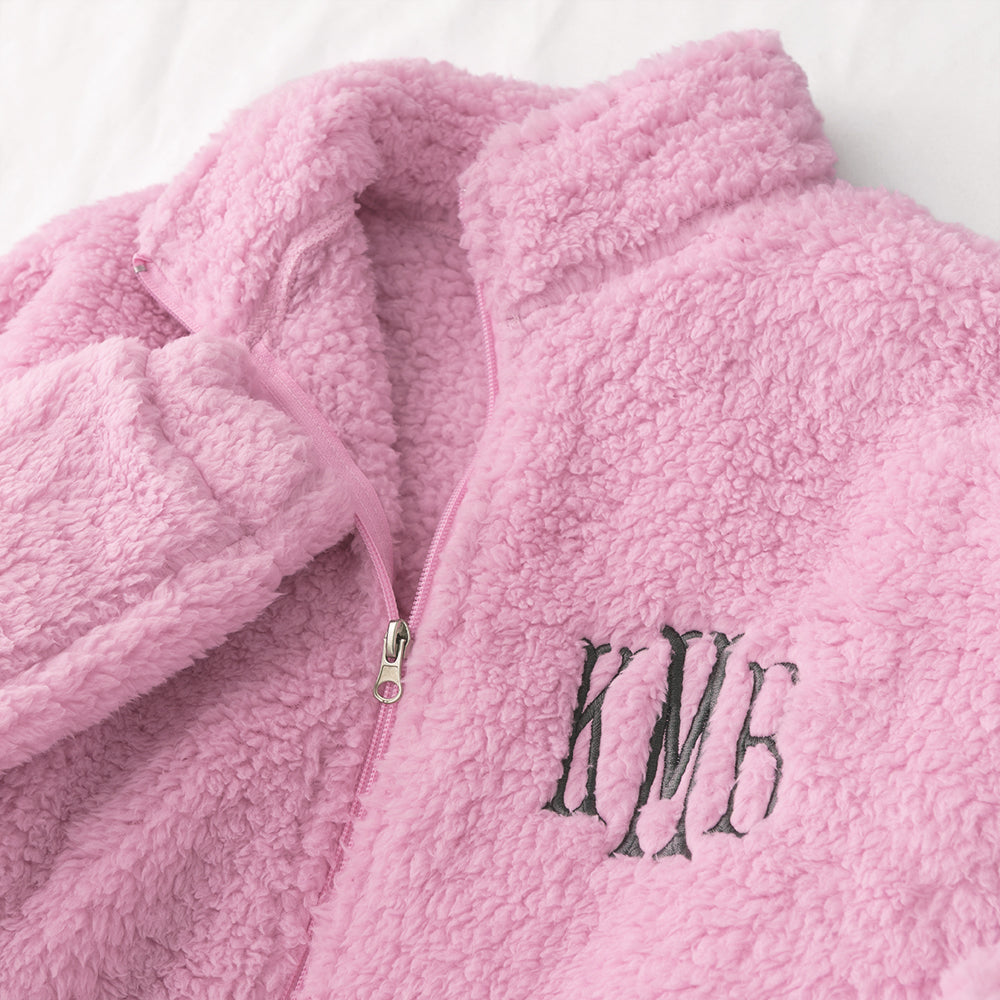 up close of light pink monogrammed full zip sherpa jacket
