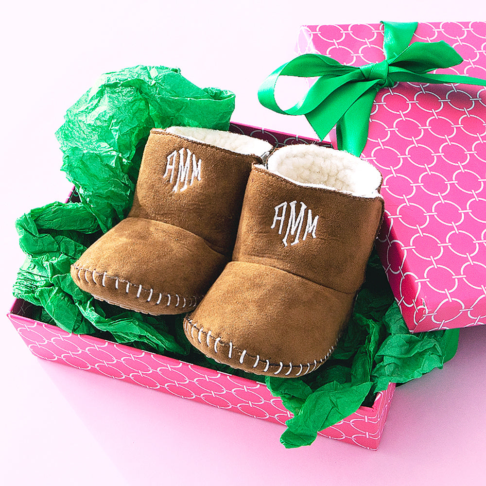 brown monogrammed baby booties in gift box