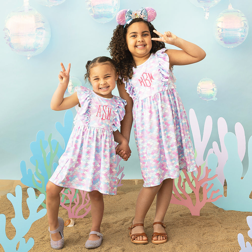 [aubri] mermaid ruffle dresses on two girls sea background