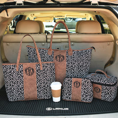 black dot collection in car with train case