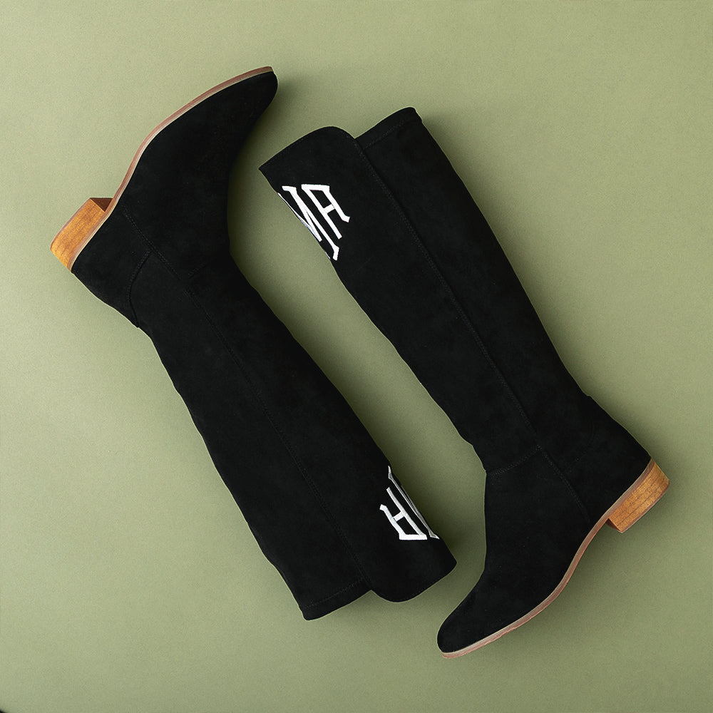 F26 tall riding boots in black on green