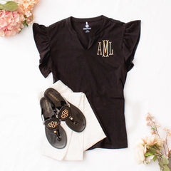 black flutter sleeve top flatlay