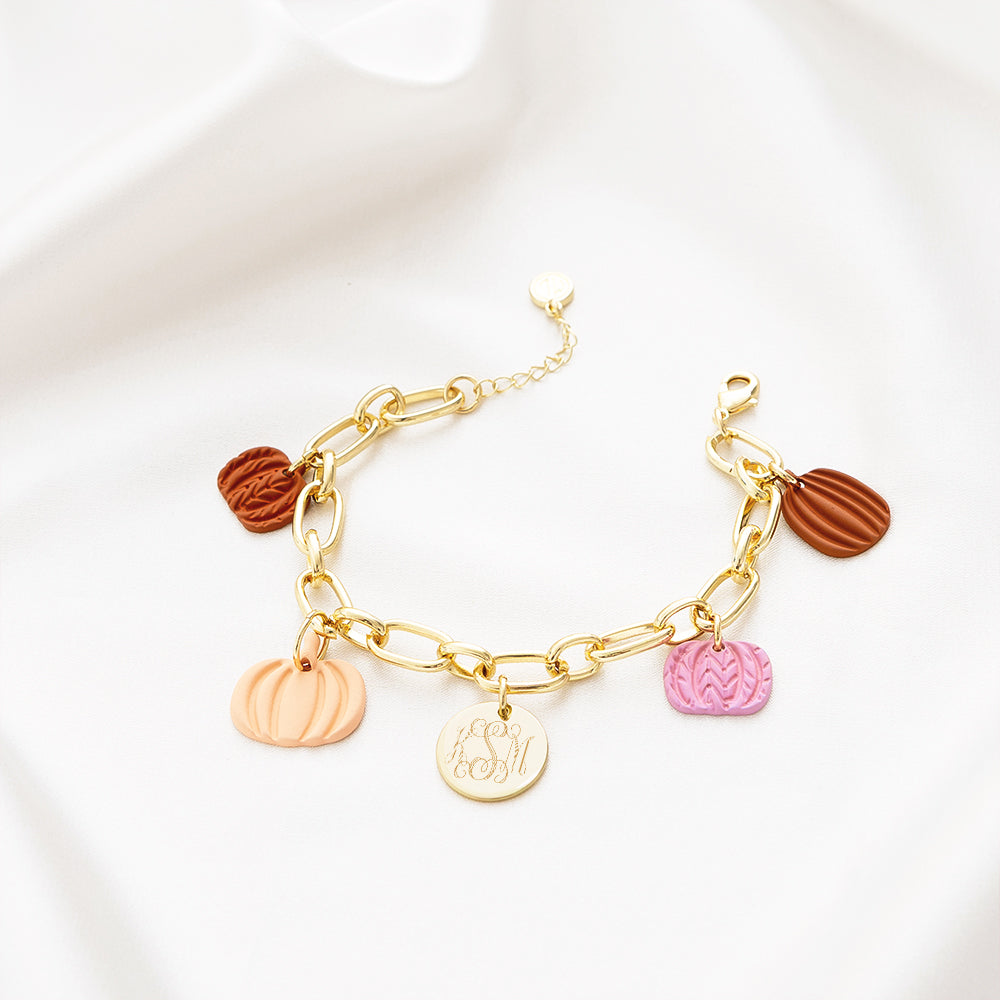 Fall charm bracelet on white satin