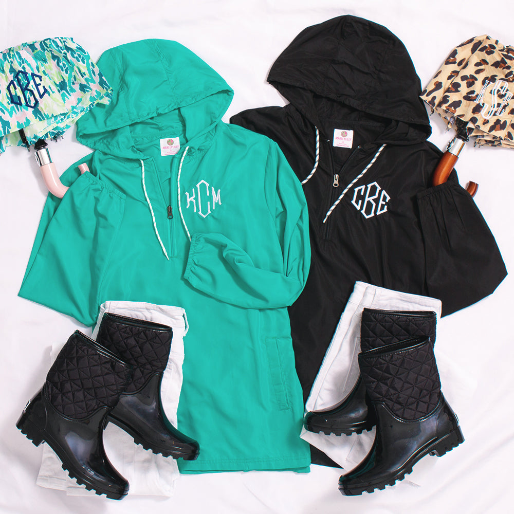 black and teal monogrammed pullover rain jackets with umbrellas