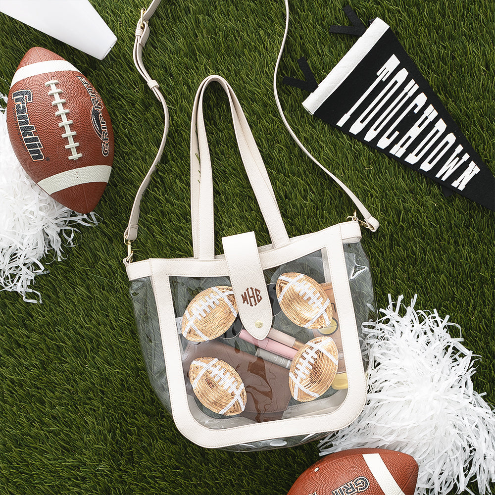 Football clear stadium approved tote flatlay on grass