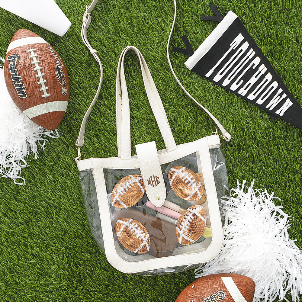 Football clear stadium approved tote flatlay on grass