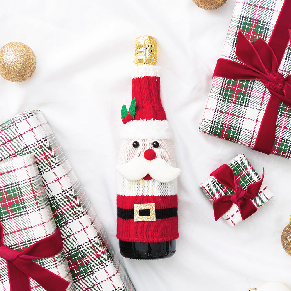 santa wine bottle sweater flatlay