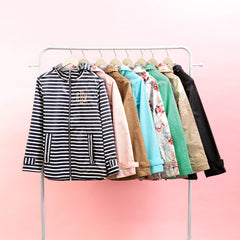 monogrammed new england rain jackets on clothing rack