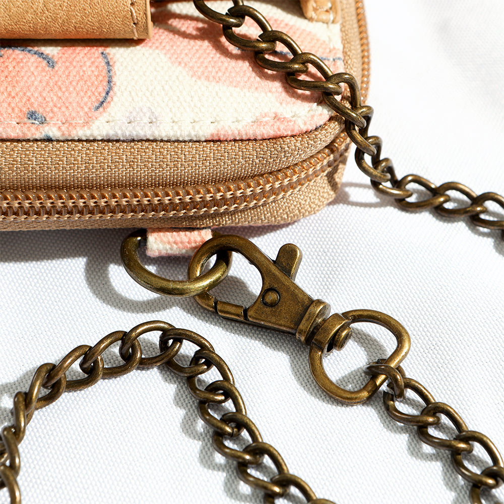 close up of lobster claw clip attached to phone wallet wristlet