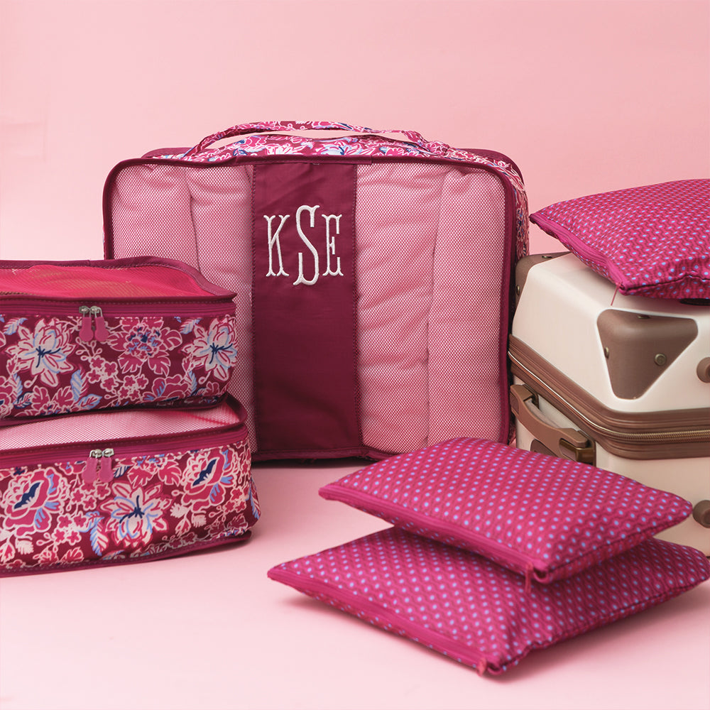 Burgundy Woodland Blossom packing bag set on pink