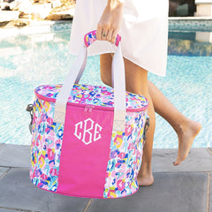 watercolor monogrammed cooler in hands at pool