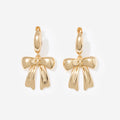 bow huggie hoop earrings in gold