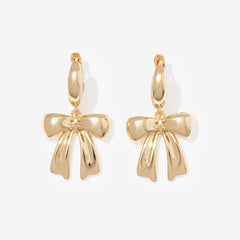 bow huggie hoop earrings in gold