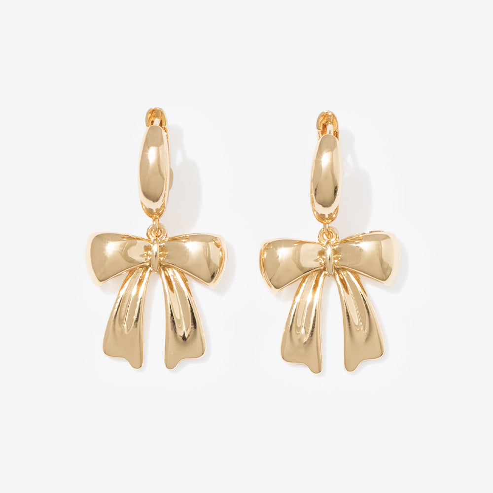 bow huggie hoop earrings in gold