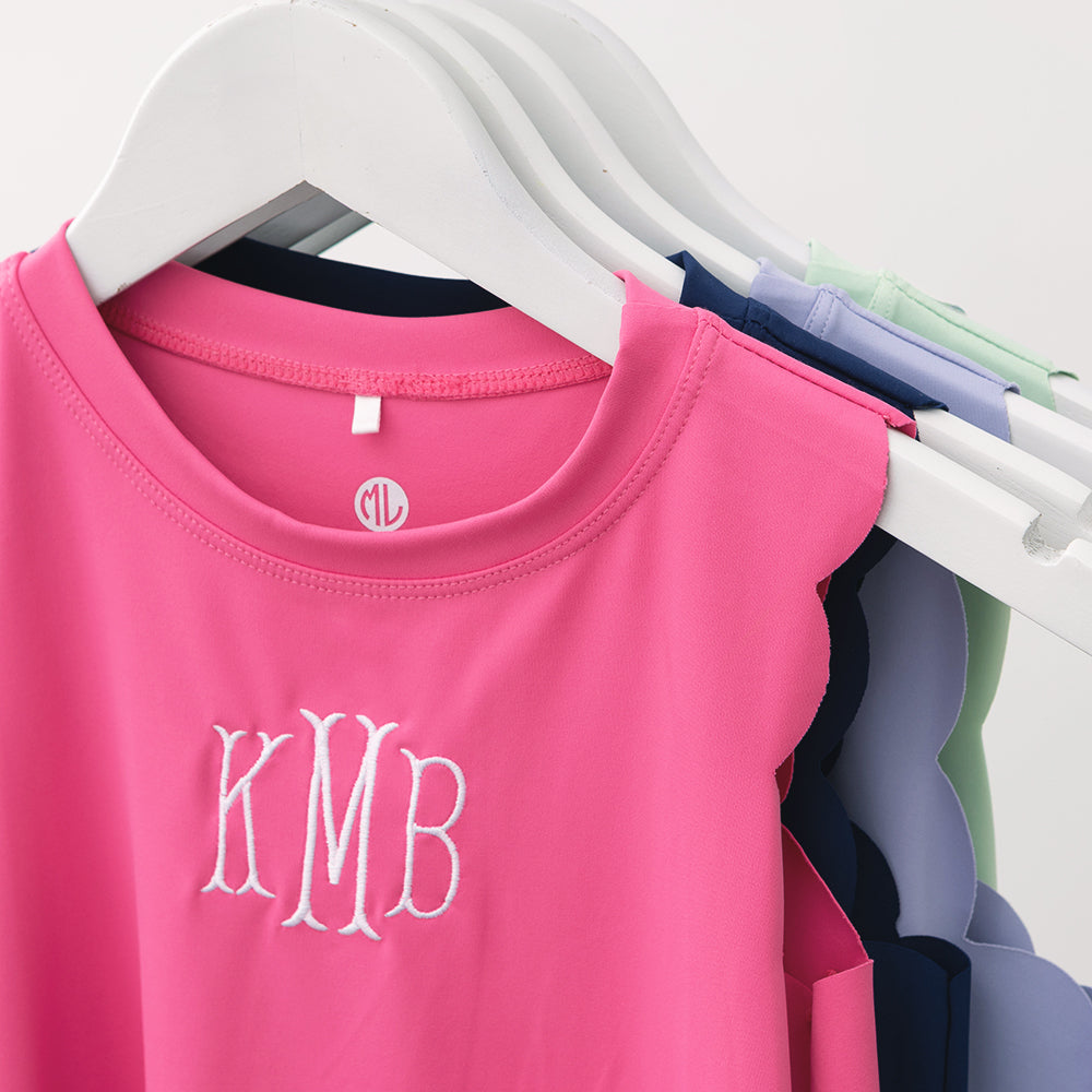 close up of personalized girls scallop dress in hot pink