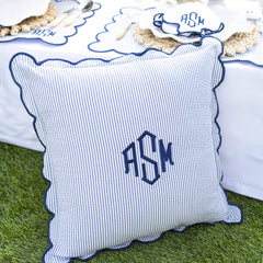 navy seersucker scalloped pillow sham on grass
