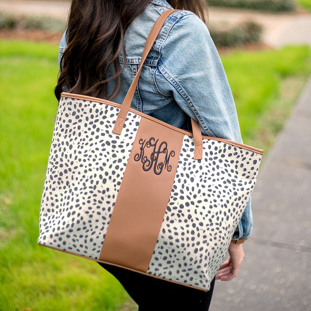 girl wearing monogrammed leopard tote on shoulder