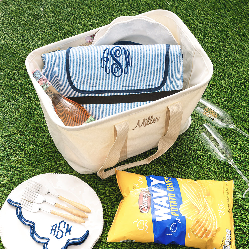 foldable monogrammed picnic blanket in navy seersucker in market basket