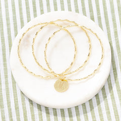 Gold Scalloped Bangle on green stripes