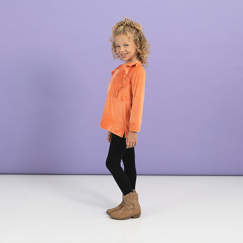 wearing softspun ruffle Sweatshirt in pumpkin from side