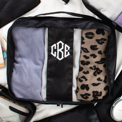 black packing bag flatlay