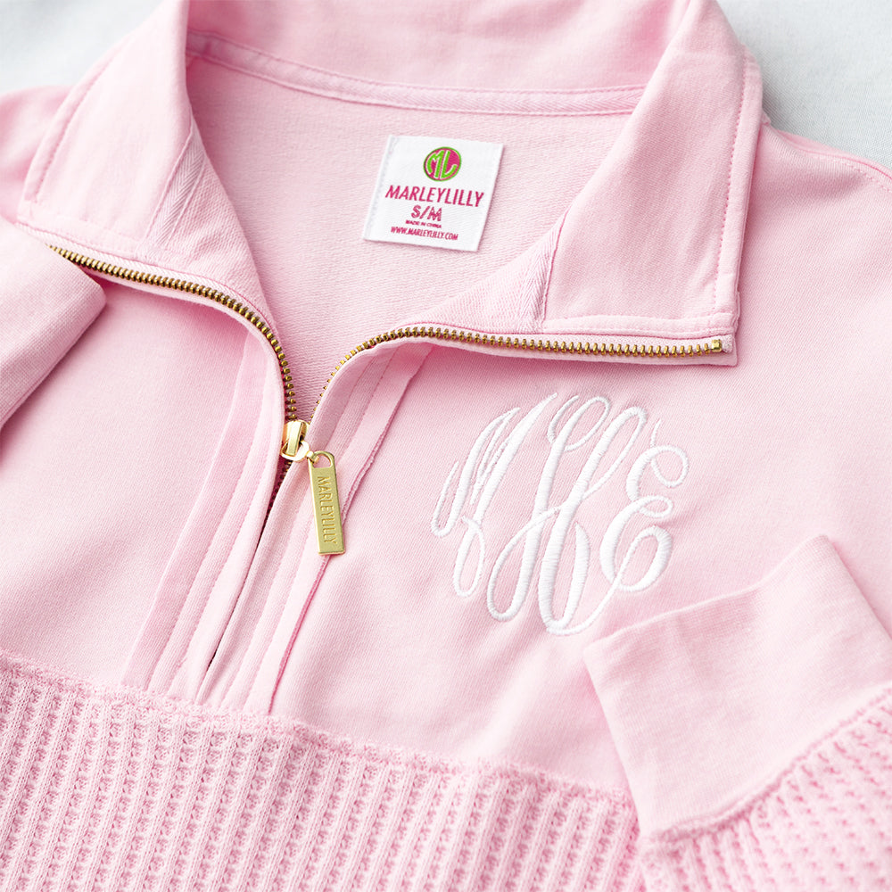 light pink waffle knit pullover up close
