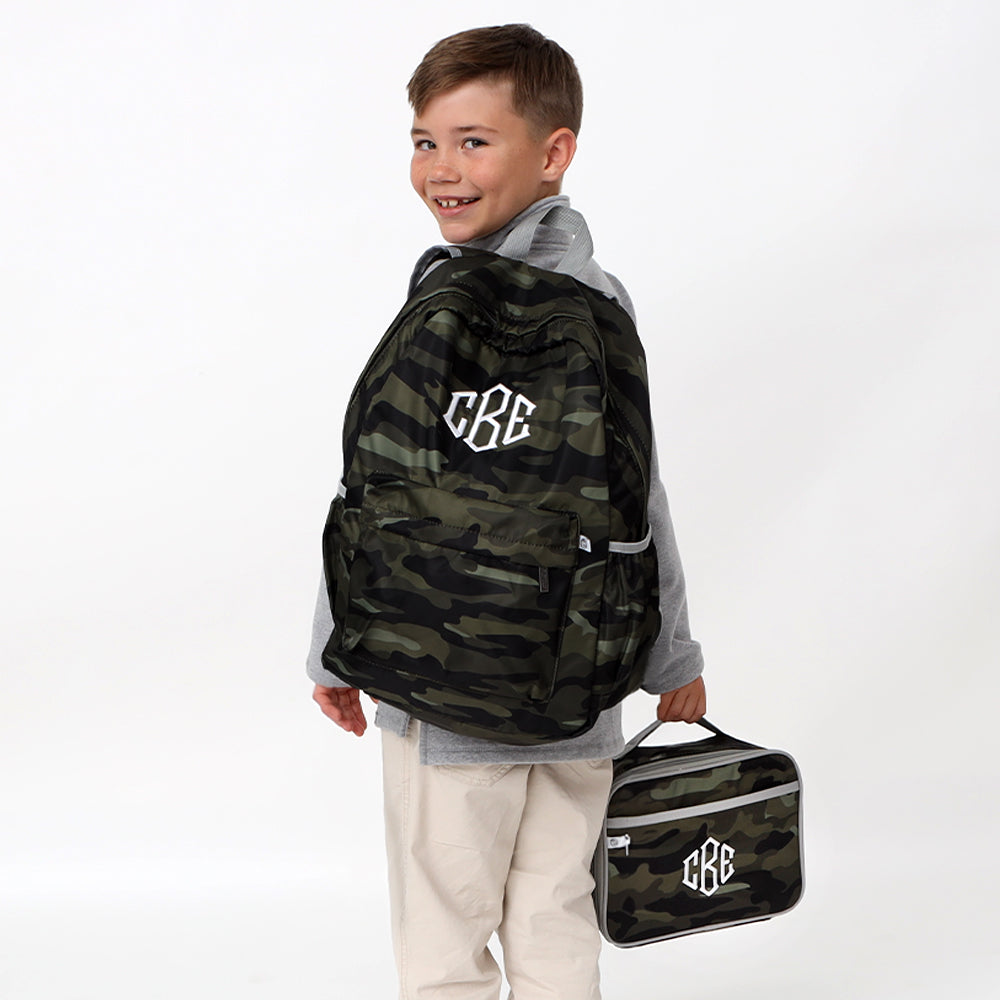 looking back with camo backpack and lunchbox
