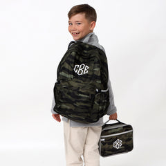 looking back with camo backpack and lunchbox